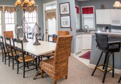 Kitchen and dining area at Pink Pelican cottage - Manteo, NC